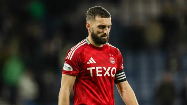 GLASGOW, SCOTLAND - NOVEMBER 02: Aberdeen's Graeme Shinnie looks dejected at full time during a Premier Sports Cup semi-final match between Celtic and Aberdeen at Hampden Park, on November 02, 2024, in Glasgow, Scotland. (Photo by Craig Foy / SNS Group)