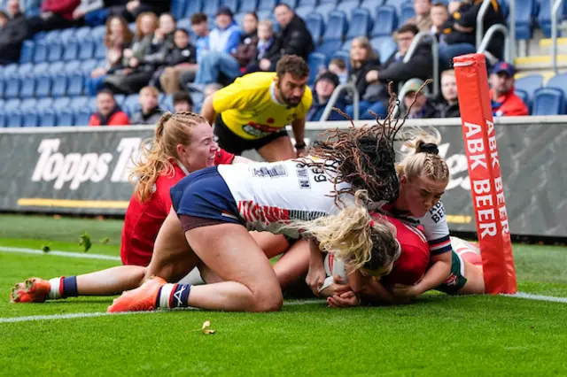 Bethan Dainton of Wales touches dives for a try before being disallowed