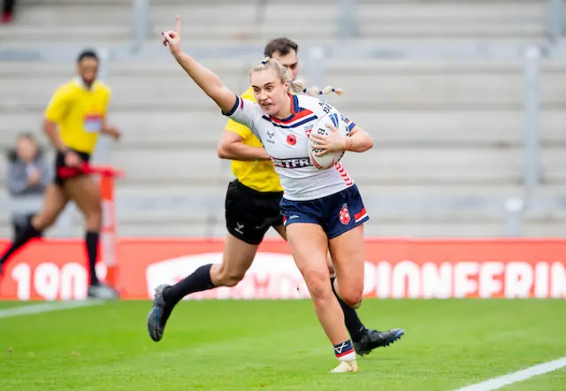 Paige Travis celebrates a try