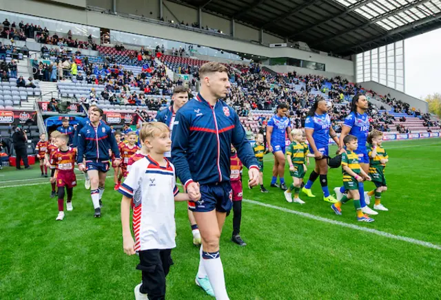 England's George WIlliams leads his side out against Samoa