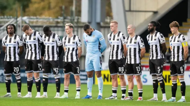 St Mirren players observing a minute's silence