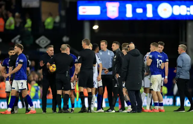 Kieran McKenna speaks to the referee