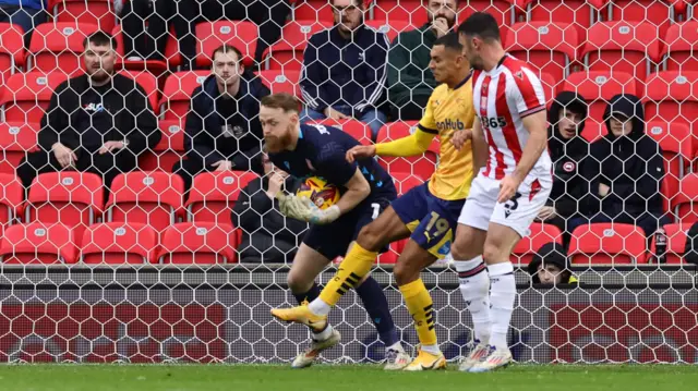 Stoke keeper Viktor Johansson gathers