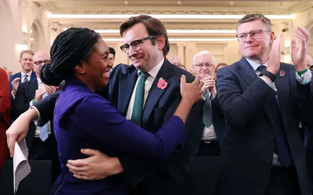 New Conservative Party leader Kemi Badenoch (L) hugs her husband Hamish (C) following the party's new leader announcement in London,