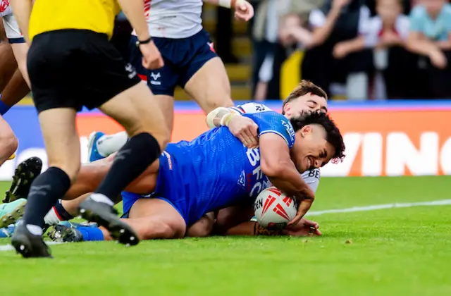 Samoa's Shawn Blore scores a try against England