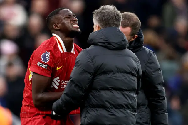 Liverpool's French defender #05 Ibrahima Konate reacts to an injury