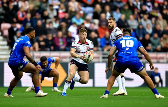 Harry Newman of England runs with the ball