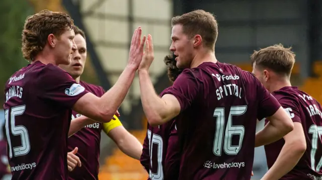 Hearts players celebrate their opener