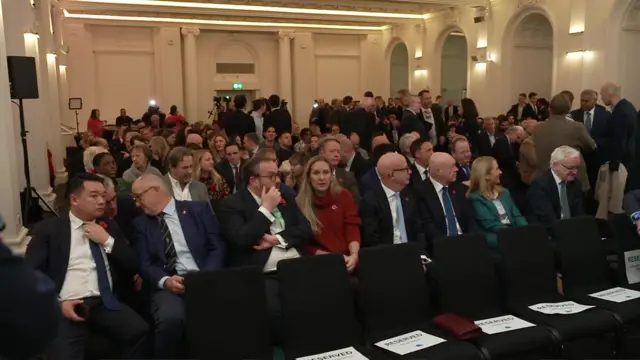 The room, filled with people and cameras, where the Tory leadership results will be announced