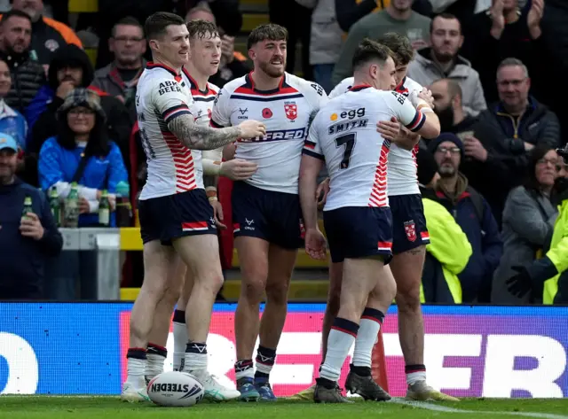 England's Matty Ashton celebrates scoring a try against Samoa