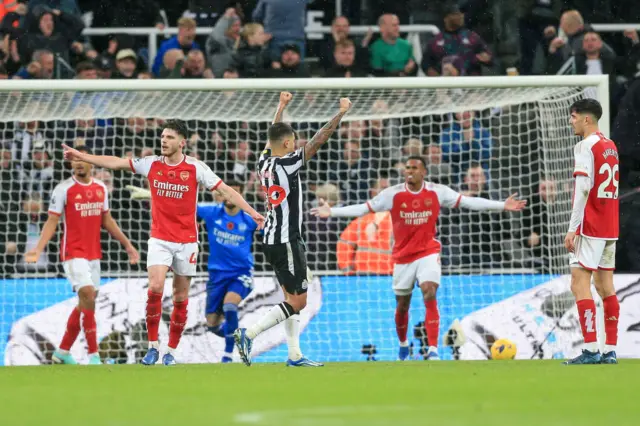 Arsenal players reacting angrily to Newcastle's goal