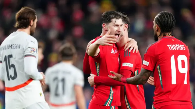 Ben Davies celebrates following Wales' Nations League win over Iceland in Cardiff