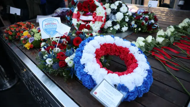 Flowers and wreaths laid in memory of those who died