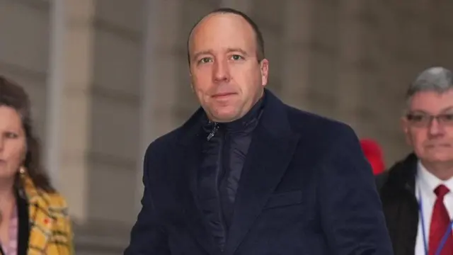 Former Health Secretary Matt Hancock, wearing a blue winter coat, arrives at the Covid Inquiry in central London on Thursday 21 November