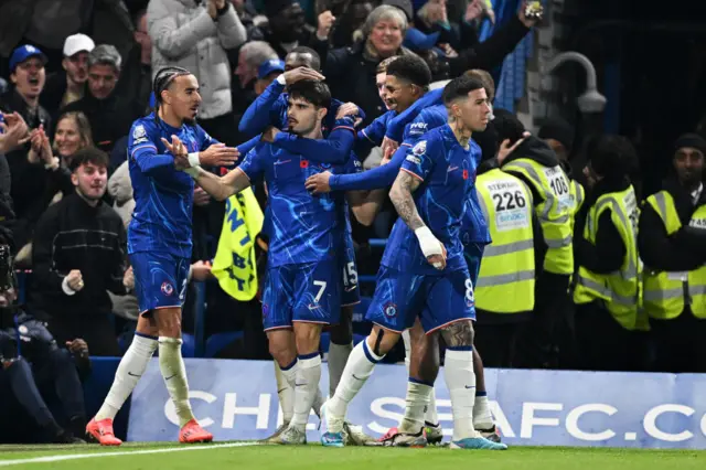 Chelsea's players celebrate after Pedro Neto's goal against Arsenal