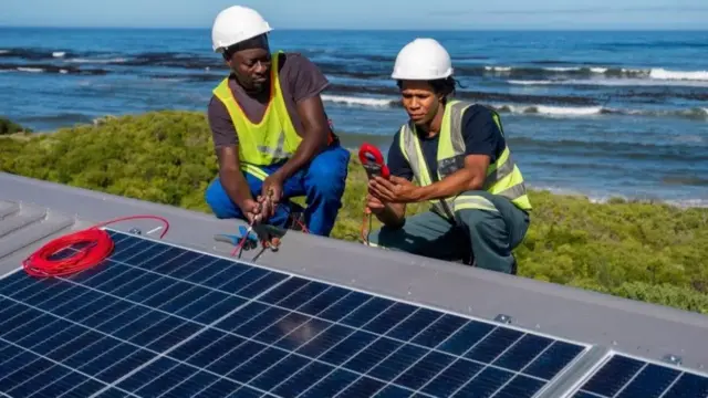 Two engineers with solar panel