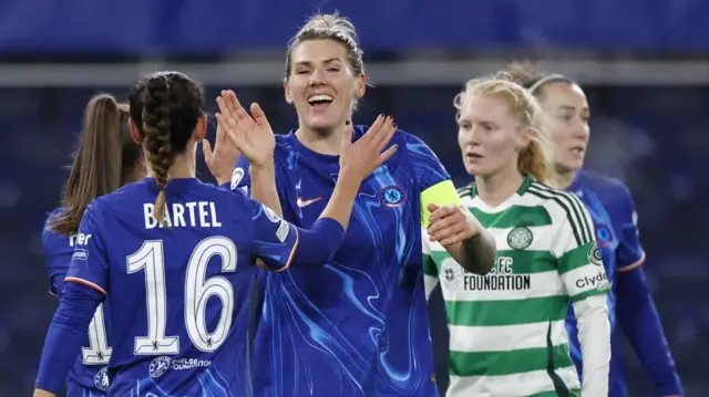 Millie Bright smiles as she high-fives a Chelsea team-mate following their Women's Champions League win over Celtic