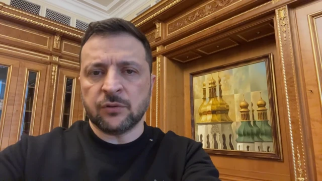 Ukrainian President Volodymyr Zelensky is shown in the presidential palace in a still from a video address.