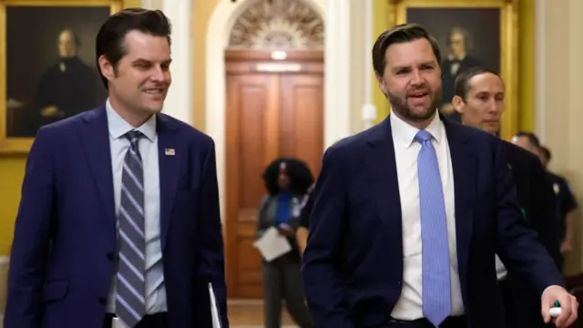 Gaetz and Vance walking down a corridor both smiling