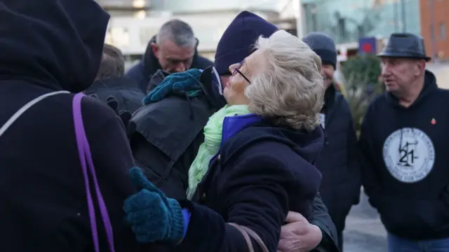 Julie Hambleton and another campaigner in a hug at the event