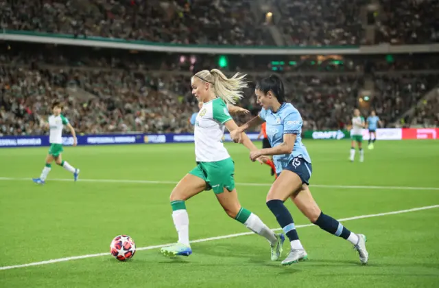 Stina Lennartsson of Hammarby is challenged by Leila Ouahabi