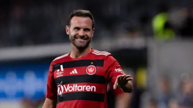 Juan Mata smiles while playing for Western Sydney Wanderers