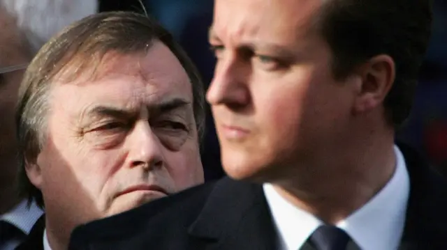 Deputy PM John Prescott, in focus, stands behind Tory leader David Cameron, out of focus, on Nov 2006 at the Remembrance Sunday Service in London