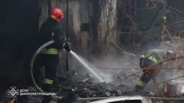 Firefighters work at the site of a Russian missile strike in Dnipro, Ukraine November 21, 2024