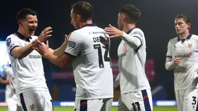 Tranmere Rovers players celebrate scoring a goal