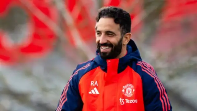 Manchester United head coach Ruben Amorim smiles at the club's training ground