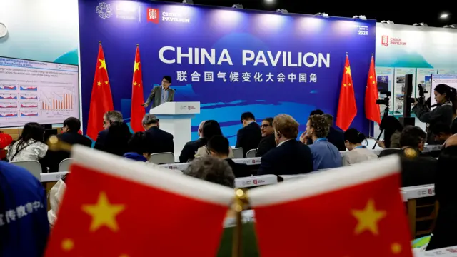 Visitors listen to a lecture at the China's pavilion at the UN Climate Change Conference COP29 in Baku, Azerbaijan, 13 November 2024