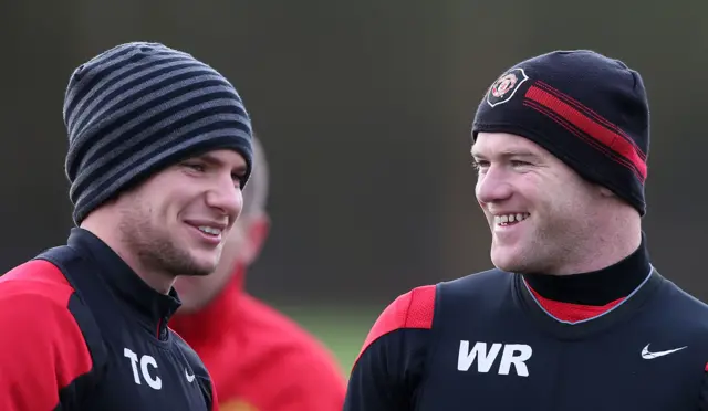 Tom Cleverley and Wayne Rooney engage in conversation