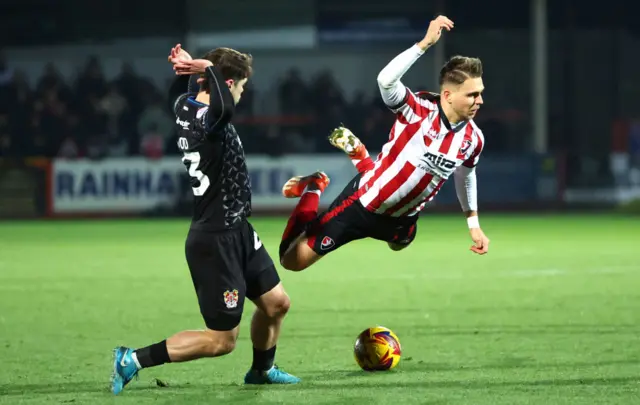 Cheltenham's Lewis Payne is booked for diving