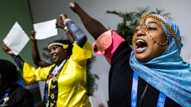 Reuters Activists perform an action to celebrate the children at the COP29 United Nations climate change conference, in Baku, Azerbaijan November 21, 2024