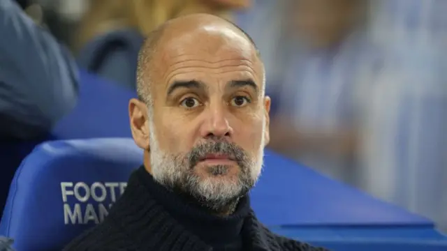 Pep Guardiola looks on during the defeat to Brighton