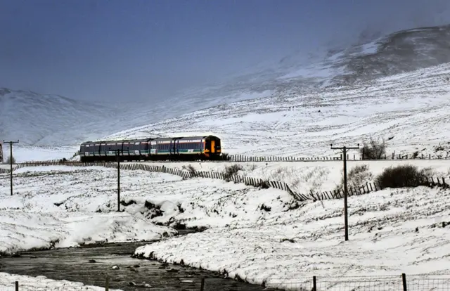 A train near Aviemore after heavy snow falls covered Scotland