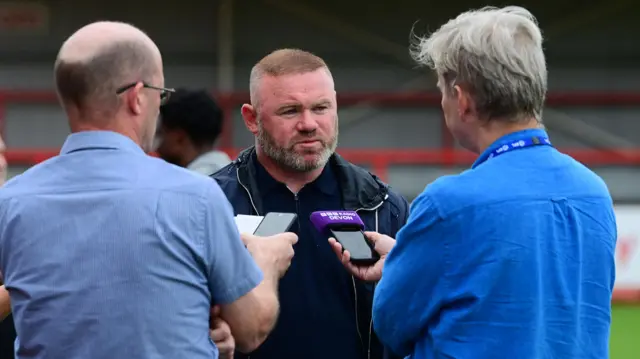 Plymouth head coach Wayne Rooney speaks to the media