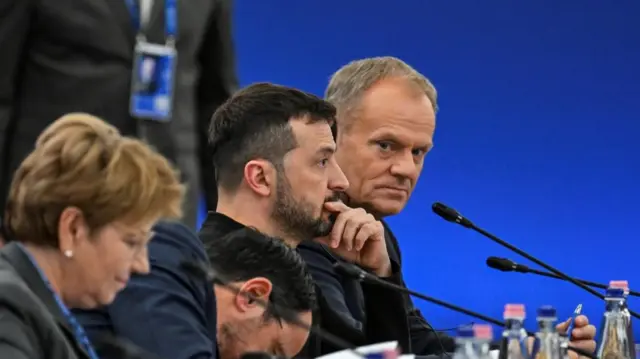 Ukraine's President Volodymyr Zelenskiy and Polish Prime Minister Donald Tusk attend the European Political Community Summit