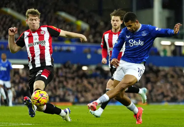 Brentford's Nathan Collins (left) and Everton's Iliman Ndiaye battle for the ball during the Premier League match at Goodison Park