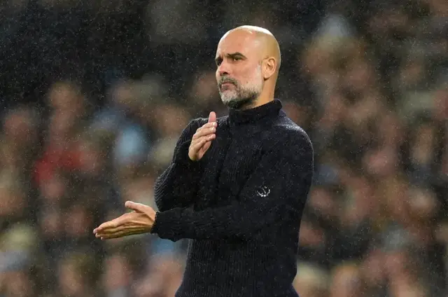 Guardiola claps his hands together