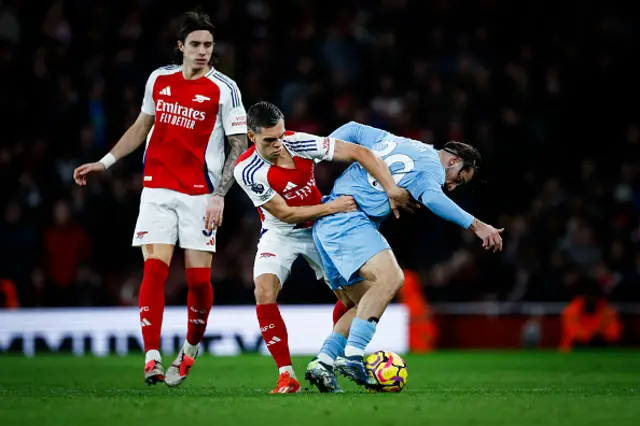 Leandro Trossard (C) fights for the ball Nottingham Forest's Portuguese striker Jota Silva