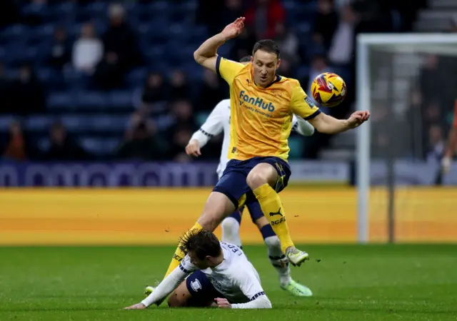 Preston North End's Ryan Ledson (bottom) and Derby County's Craig Forsyth battle for the ball