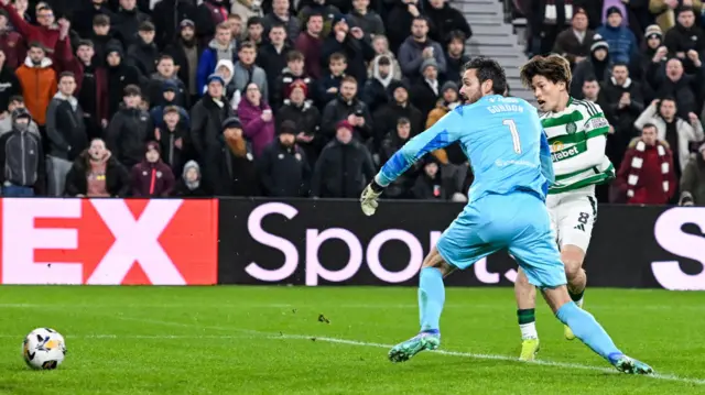 EDINBURGH, SCOTLAND - NOVEMBER 23: Celtic's Kyogo Furuhashi scores to make it 1-0 during a William Hill Premiership match between Heart of Midlothian and Celtic at Tynecastle Park on November 23, 2024, in Edinburgh, Scotland. (Photo by Paul Devlin / SNS Group)