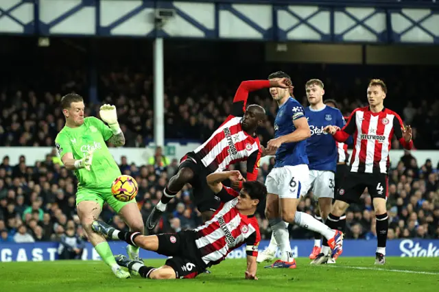 Jordan Pickford of Everton is fouled by Christian Norgaard of Brentford leading to a red card