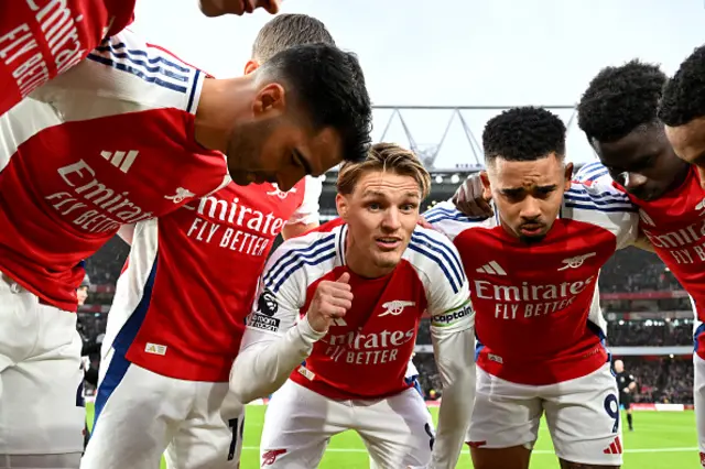 Martin Odegaard of Arsenal speaks to his side