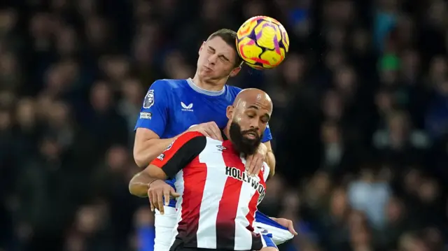 Everton's Vitaliy Mykolenko and Brentford's Bryan Mbeumo battle for the bal