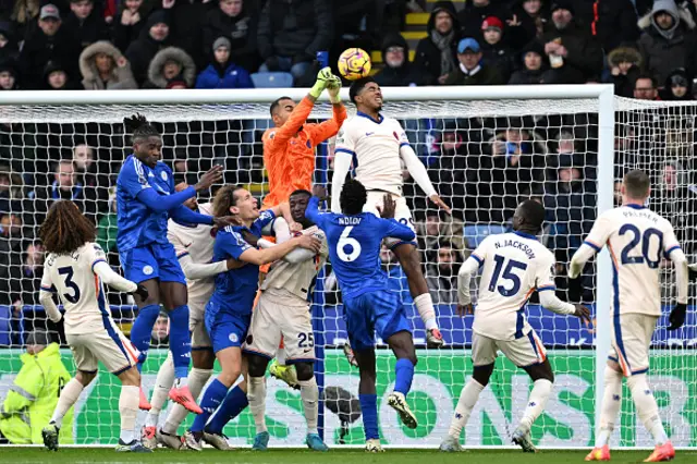 Robert Sanchez and Wesley Fofana of Chelsea attempt to clear the ball