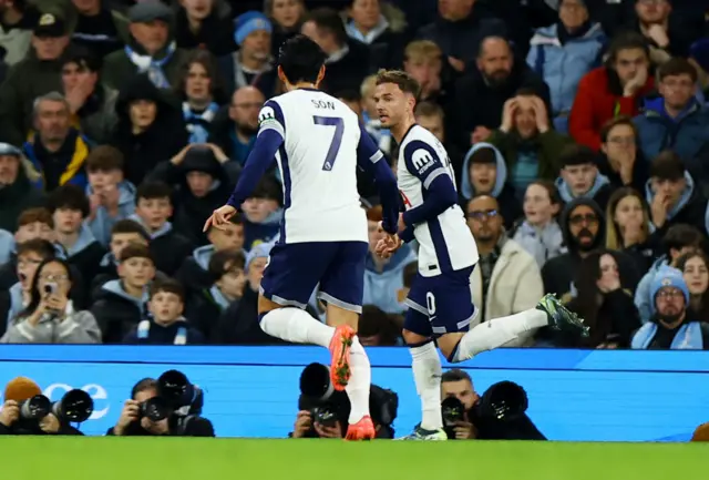 Maddison runs to celebrate his goal with Son