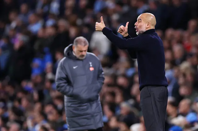 Pep Guardiola manager of Manchester City looks on