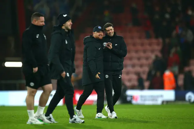 Fabian Huerzeler, Manager of Brighton & Hove Albion, speaks to Assistant Head Coach Jonas Scheuermann